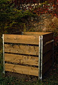 Compost rack with boards and metal posts