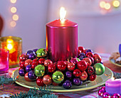 Colourful ball wreath with pink-metallic pillar candle