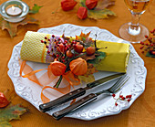 Autumn napkin decoration with little Physalis bouquet