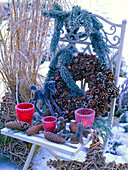 Pine cones and acorns wreath with hoarfrost