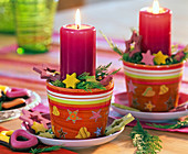 Colourful pots as candle holders