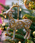 Metal stag decorated with gilded tendrils
