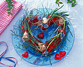 Heart-shaped wreath with Muscari (grape hyacinths) with washed-out roots