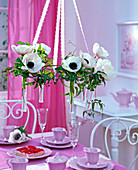 Hanging table decoration with white anemone coronaria (crown anemone)