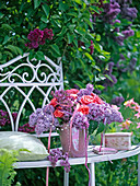 Bouquet of Syringa (lilac), pink (roses), decorated with pearl ribbon