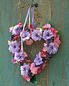 Heart-shaped wreath made of Delphinium (larkspur, purple), Hydrangea (hydrangea)