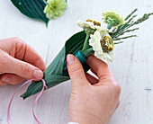 Small bouquet in hosta leaf