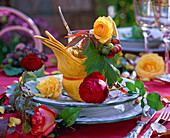 Autumn Table decoration with roses and grapes