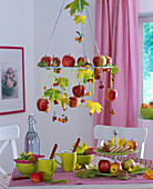 Hanging wreath with Malus (ornamental apple), Acer (maple) in autumn color