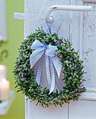 Rosmarinus, wreath tied with bow ribbon to doorknob