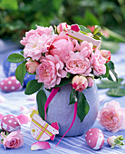 Pink (rose) bouquet in light blue vase, chickens, eggs