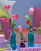 Pink tulip flowers in bottles
