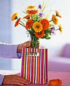 Bouquet of marigolds in gift bag (1/2)
