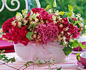 Arrangement of hydrangea and clematis in Jardiniere