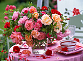 Bouquet of different pink (rose) in glass vase, bowl