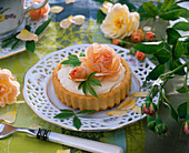 Pink (rose) - on small cake, cutlery