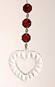 Glass pendant of red and transparent glass with heart