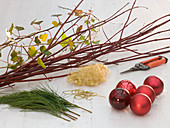 Advent wreath with red balls, branches and ivy (1/6)