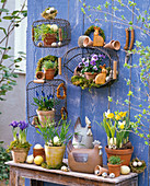 Easter arrangement with suspended wire baskets over side table