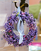 Wreath of myosotis (forget-me-not) on a door handle