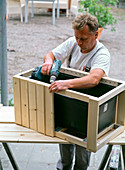 Bucket with homemade wooden paneling