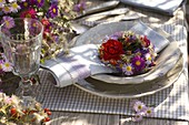 Table decoration with asters and roses