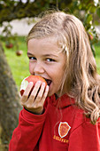 Girl eats apple