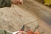 Heart made of rosehips and hydrangea