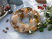 Homemade winter decoration orange slices and nuts frozen