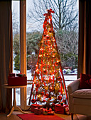 Advent calendar and Christmas tree with red sticks 12/12