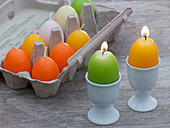 Egg cups as candle holders for egg candles