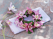 Small Ais aquilegia (columbine) wreath on white napkin