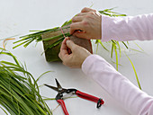 Bouquet in grass sleeves