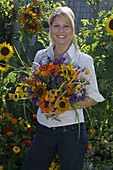 Young woman with late summer bouquet