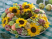 Late summer wreath with sunflowers and apples