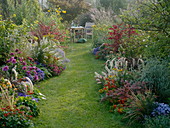 Autumnal beds with grasses, perennials, summer flowers and shrubs