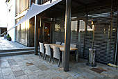 Shaded terrace with awning, seating group, heating mushroom