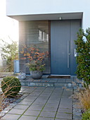 House entrance with modern grey front door