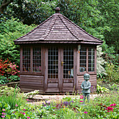 OCTAGONAL WOODEN SUMMERHOUSE with Boy Statue IN FOREGROUND LITTLE COOPERS, Hampshire