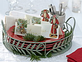 Tray with Christmas place cards pasted with wafers