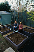 WOODEN SCAFFOLDING BOARDS USED TO MAKE RAISED BEDS FOR THE DECORATIVE CHILDRENS POTAGER PAINTED PALE Purple with CONNIE AND OLLIE