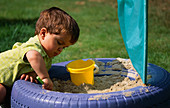 JOSHUA PLAYING IN THE TYRE SANDPIT with Kite Material SAIL