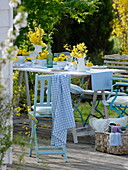 Yellow spring table decoration on the terrace