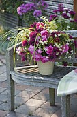 Bouquet of Rosa 'Parade' (Roses), Monarda 'Cambridge Scarlet'.