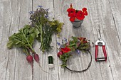 Small wreath of edible flowers, herbs and radishes