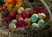 Basket with coloured Easter eggs