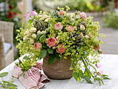 Bouquet of pink (roses), alchemilla (lady's mantle), artichokes