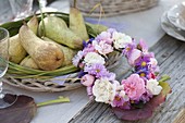 Autumn table decoration with asters and pears
