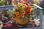 Bouquet in pumpkin as a vase