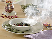 Burning incense with home-dried herbs such as sage and roses